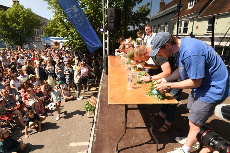 The 21st Watercress Festival took place in Alresford, Hampshire this weekend, with thousands of visitors taking to the streets of the town synonymous with producing the natural superfood, taking part in activity stalls, enjoying entertainers and musicians as well as take in the cooking expertise of professional chefs at the annual event.
Pictured: The annual Watercress eating competition..©Russell Sach - 0771 882 6138